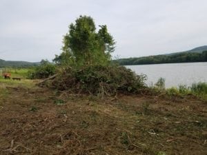 GrassMasters Landscaping Hauling Brush Pile